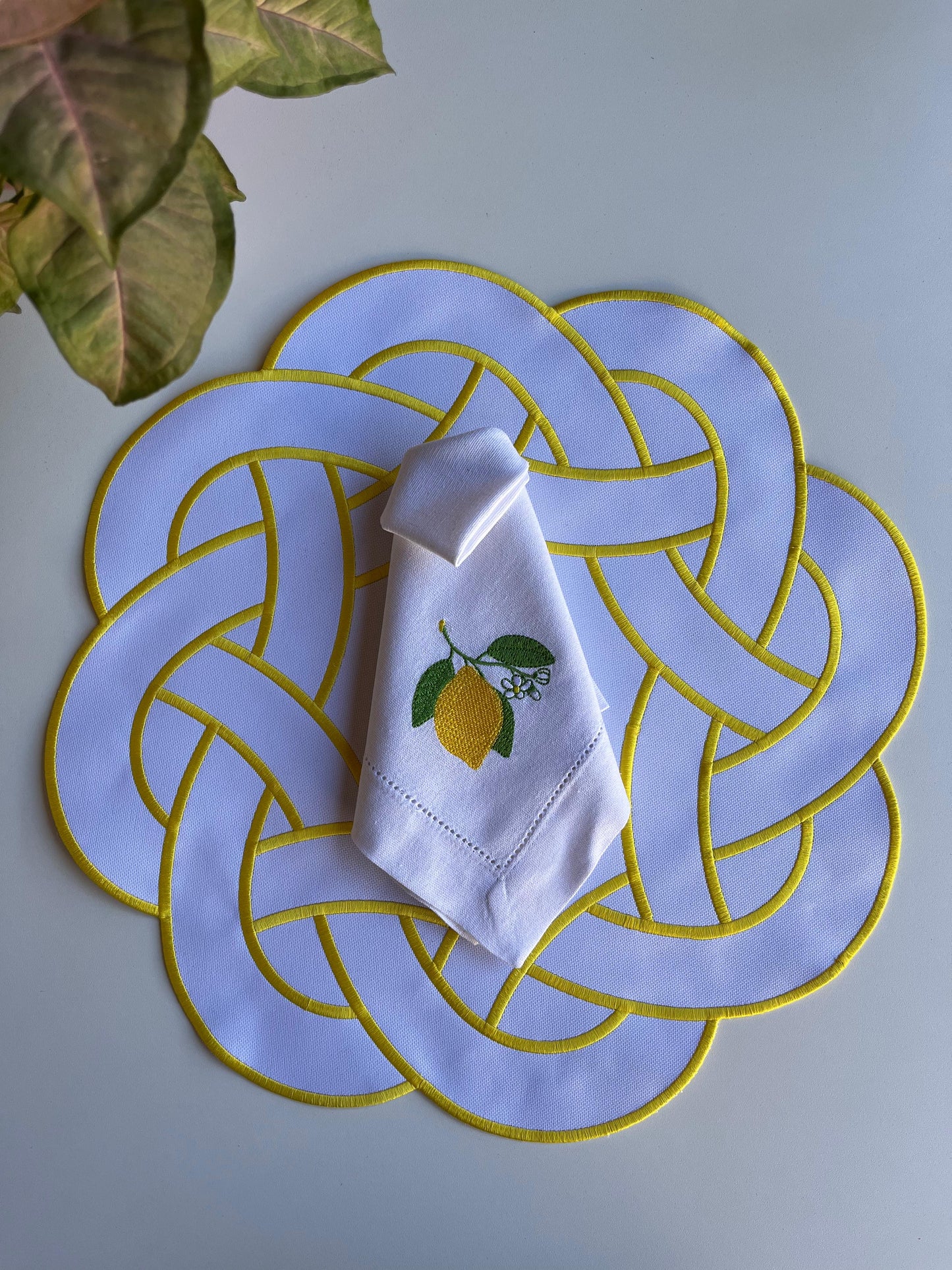 Round Placemat with Interlaced Design and Yellow Details